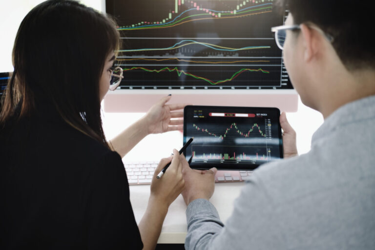 an investment expert points a pen at a tablet moni 2025 01 10 20 30 56 utc scaled