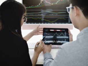 an investment expert points a pen at a tablet moni 2025 01 10 20 30 56 utc scaled