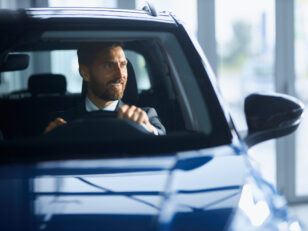businessman suit buying new car modern salon scaled