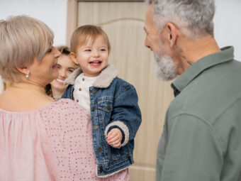 carefree child in denim jacket smiling near mother and happy grandparents in hall at home carefree child in denim jacket smiling near mother 2024 11 08 12 02 49 utc scaled