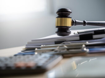 Judge and documents on office desk Legislation judge documents office desk legislation scaled