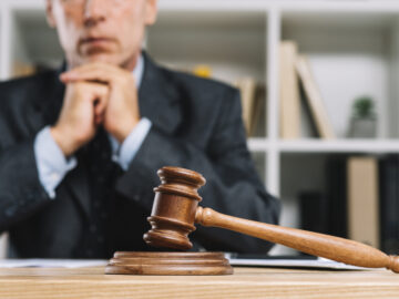 wooden judge gavel table front lawyer scaled