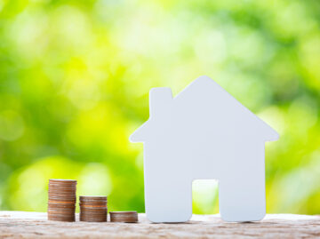 World Habitat Day,close up picture of a pile of coins and a mode world habitat day close up picture pile coins model house scaled