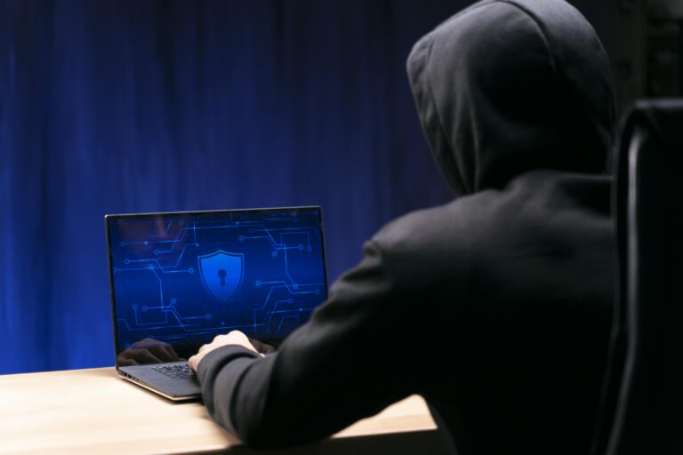 close up programmer typing laptop