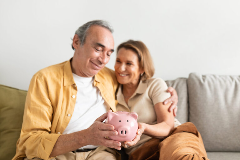 happy european senior couple holding piggybank and 2025 03 18 18 20 04 utc scaled
