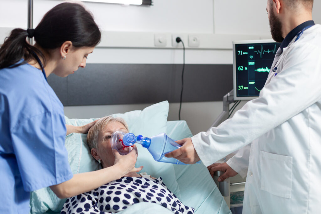 medical team helping senior woman patient laying i 2023 11 27 05 14 23 utc