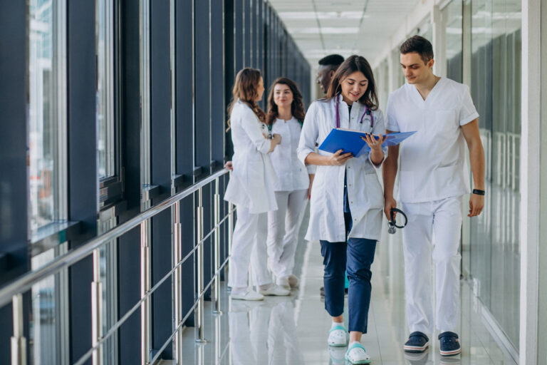 team young specialist doctors standing corridor hospital scaled