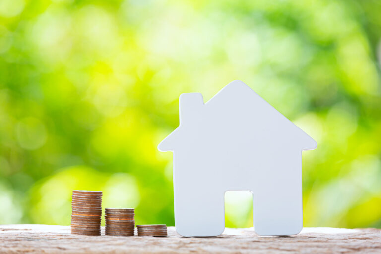 world habitat day close up picture pile coins model house scaled